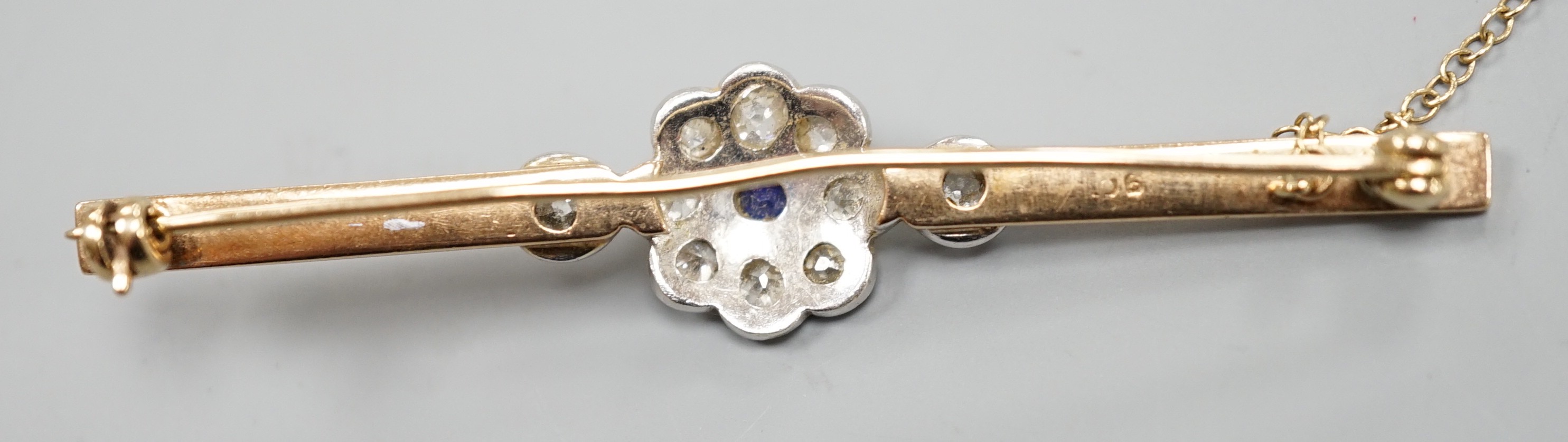 A 9ct, sapphire and diamond cluster set bar brooch (possibly converted), 65mm, gross weight 5.7 grams.